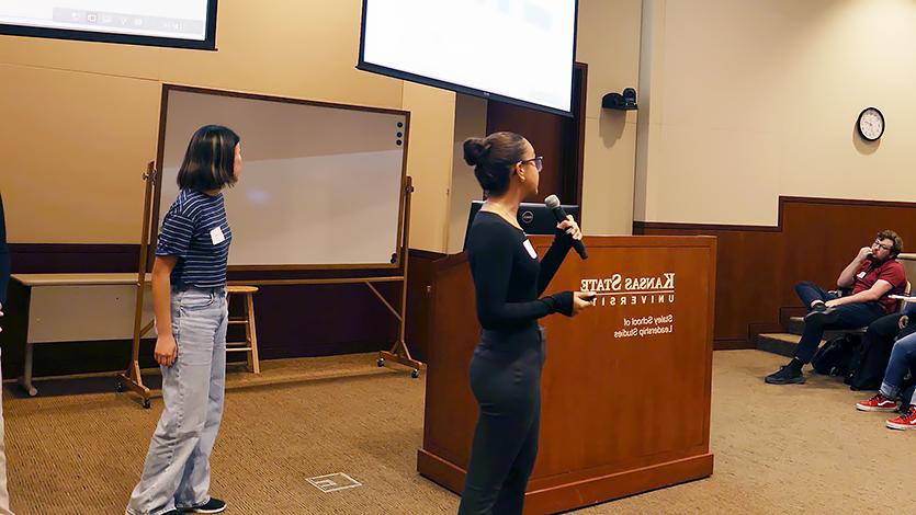 Image of Isa presents her research at the end of her Research Experience for Undergraduates to faculty at Kansas State University. 